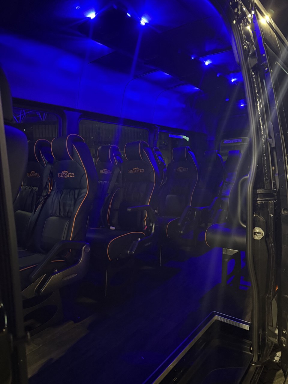 Sprinter cabin lit with blue ambient mood lighting