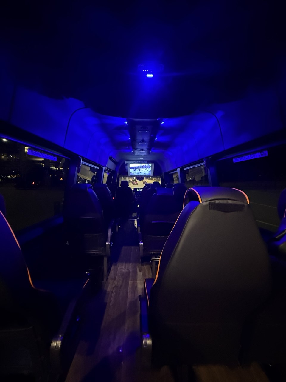 Sprinter interior at night — 40-inch smart TV and ambient lighting